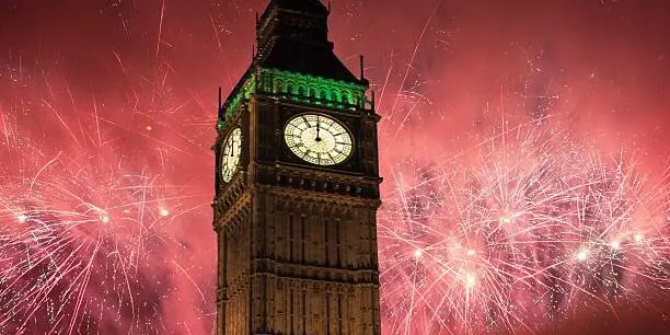 Bid Ben surrounded by exploding fireworks in the sky.